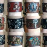 Handmade leather cuffs with metal designs